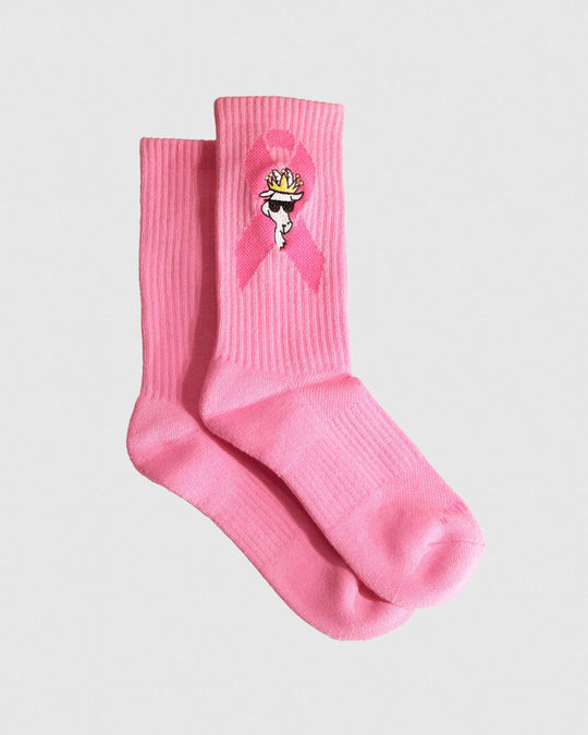 Pink socks with the Breast Cancer Awareness logo and a white goat