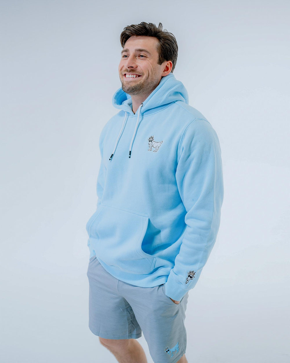 Male model wearing carolina blue WG Hooded Sweatshirt#color_carolina-blue