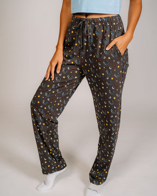 Female model wearing pajama pants with goats, teddy bears, stars and moons - bottoms only