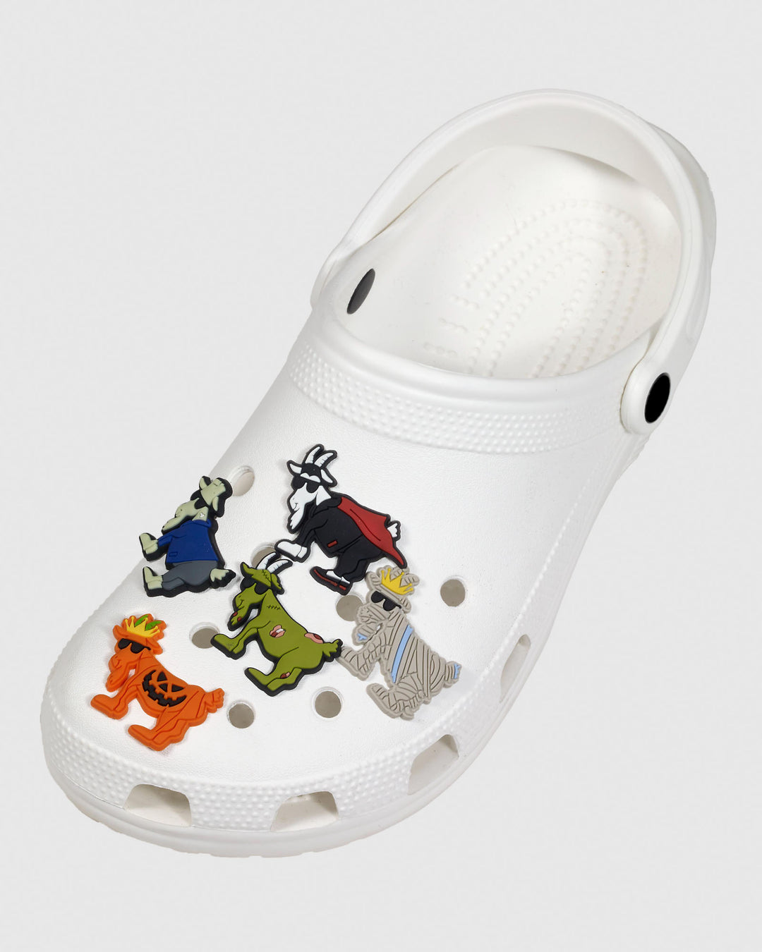 White clog with halloween-themed goat shoe charms