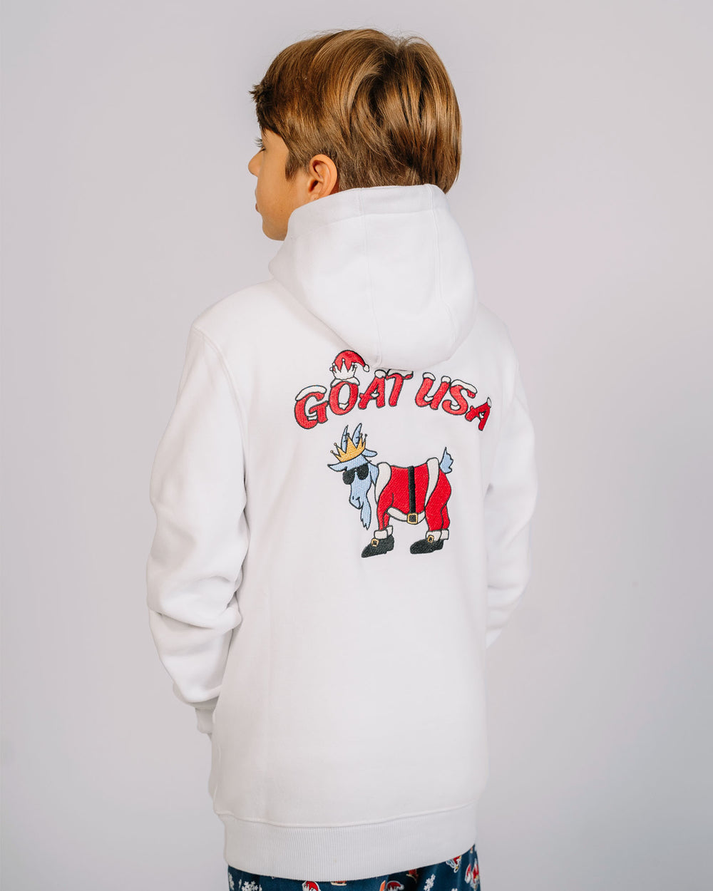 Back of Santa goat hoodie on kid model