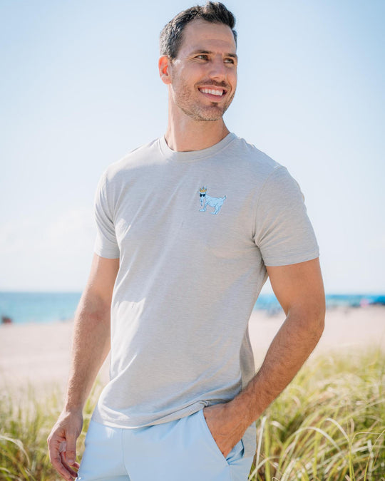 Male model near a beach wearing the space dye gray OG Athletic T-Shirt#color_space-dye-gray