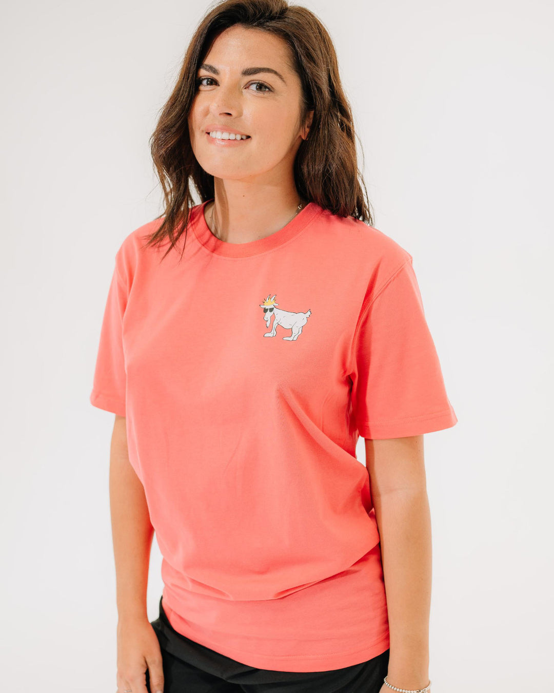 Female model wearing salmon WG T-Shirt#color_salmon