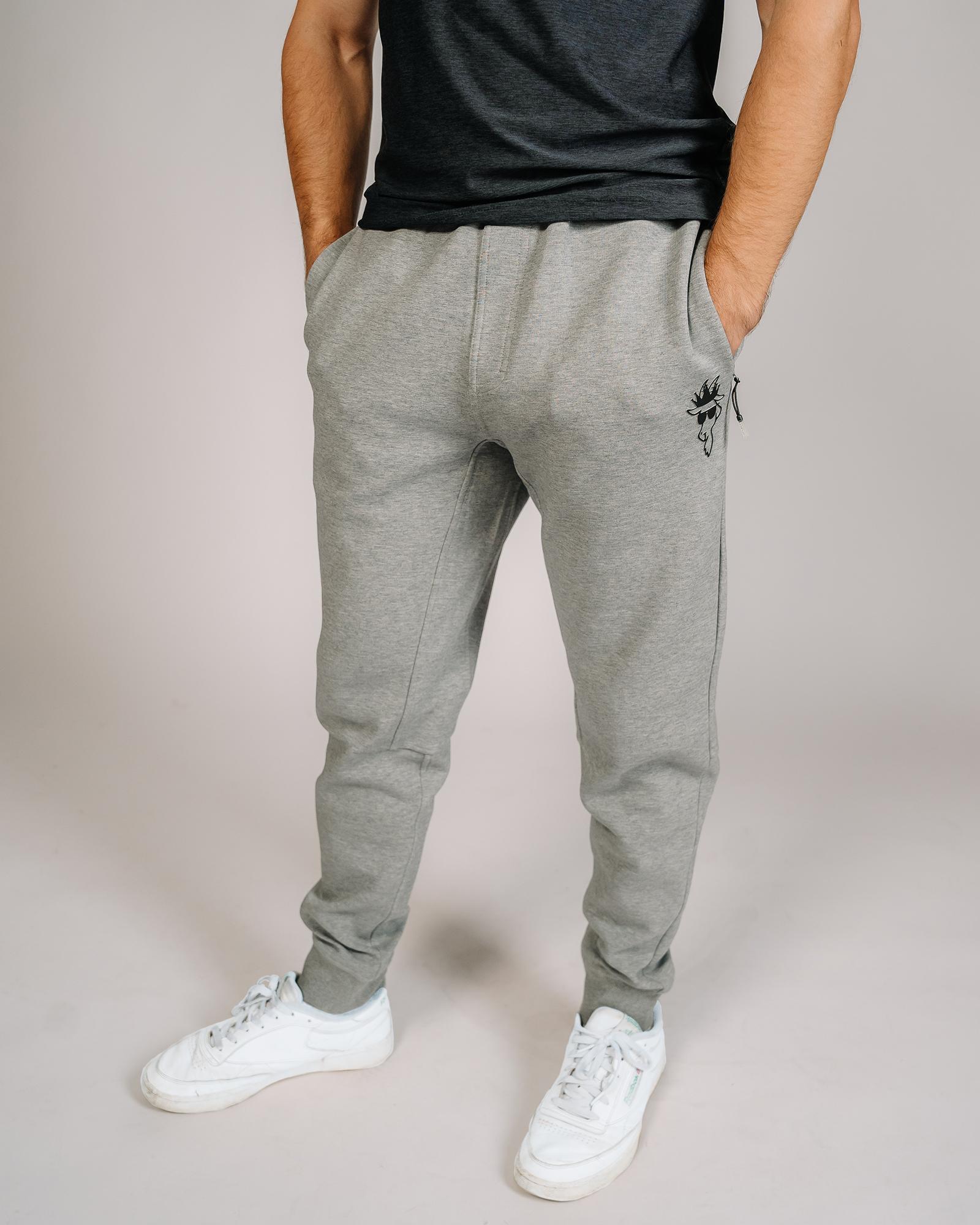 Model wearing gray performance joggers#color_gray