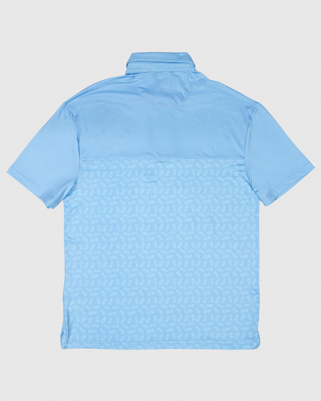 Back of blue polo with subtle pineapple print