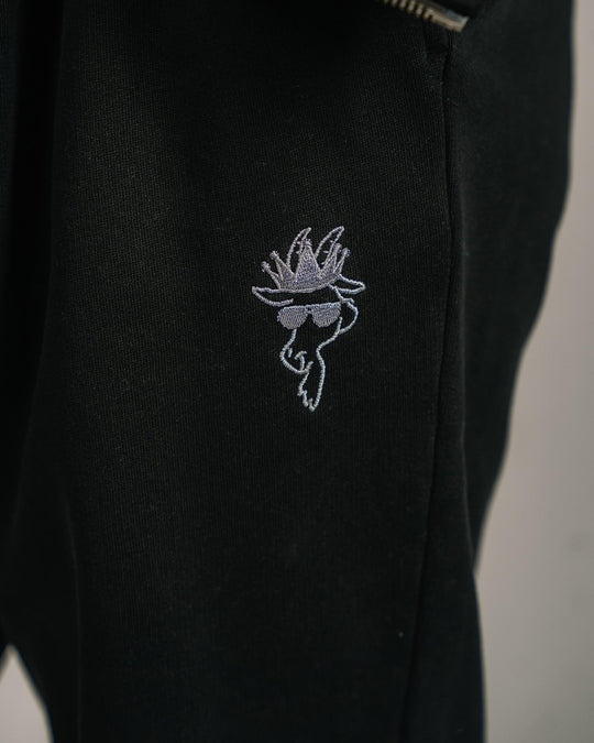 Close-up of logo on black scrunch joggers#color_black