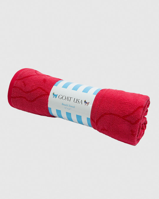 Rolled up salmon beach towel#color_salmon-red