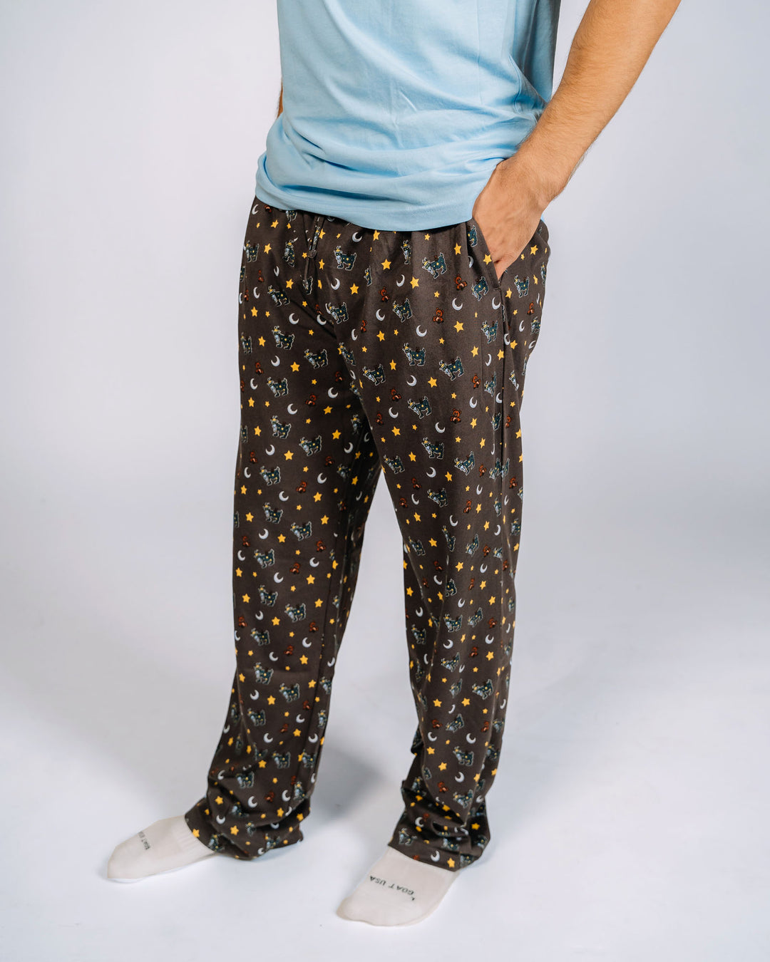 Male model wearing pajama pants with goats, teddy bears, stars and moons - bottoms only